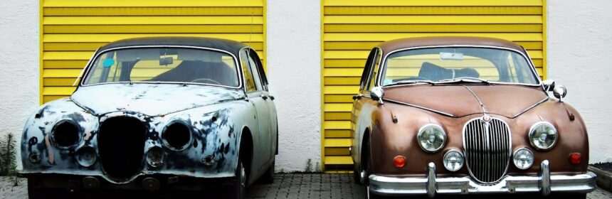 two cars in front of shutter doors