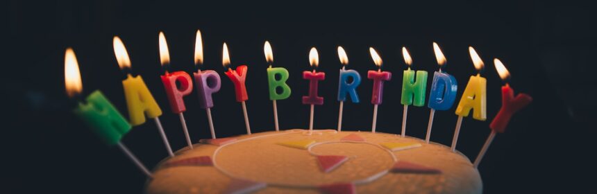 round fondant cake with happy birthday candle